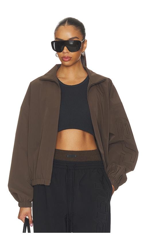 fear of god essentials active trace full zip track jacket in chocolate.