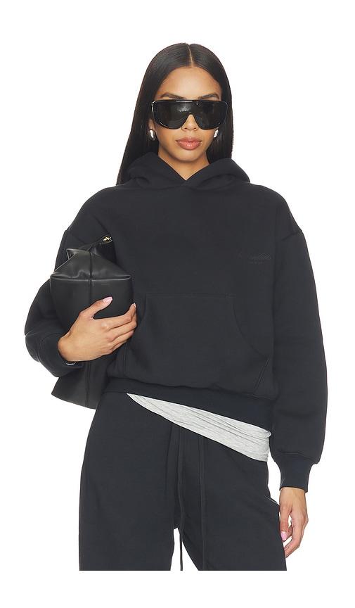 fear of god essentials classic hoodie in black.
