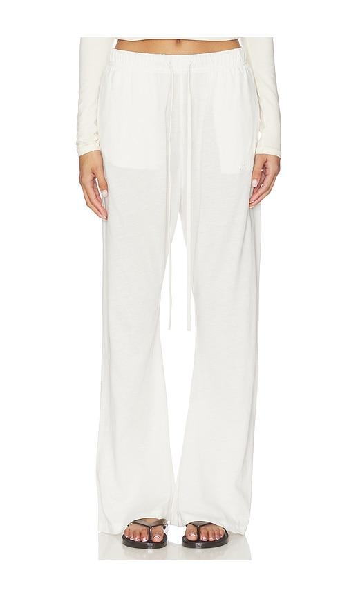 fear of god essentials flare pant in ivory.