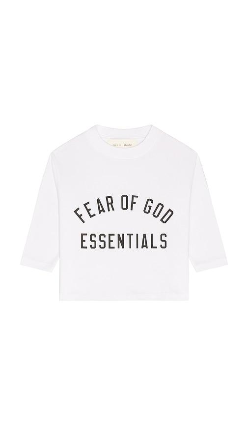 fear of god essentials kids classic long sleeve tee in white.