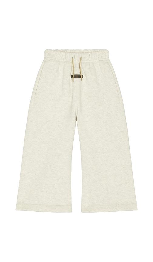 fear of god essentials kids flare sweatpant in grey.