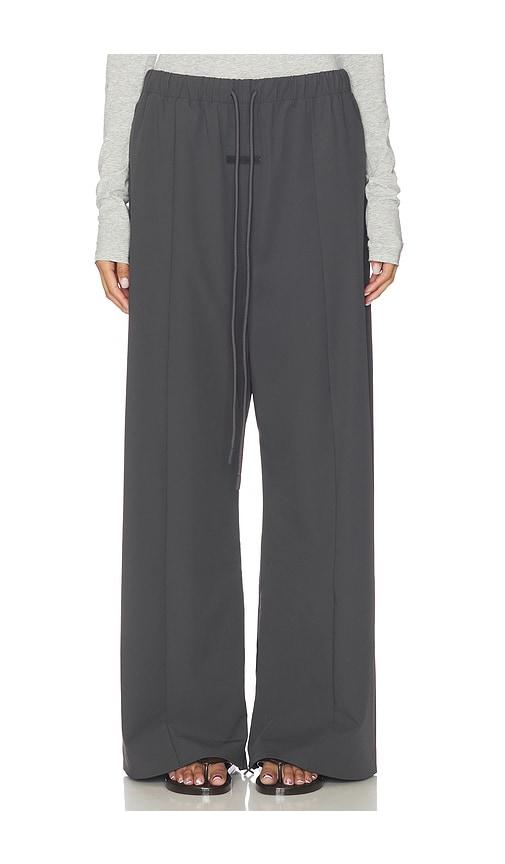 fear of god essentials relaxed track pant in grey.