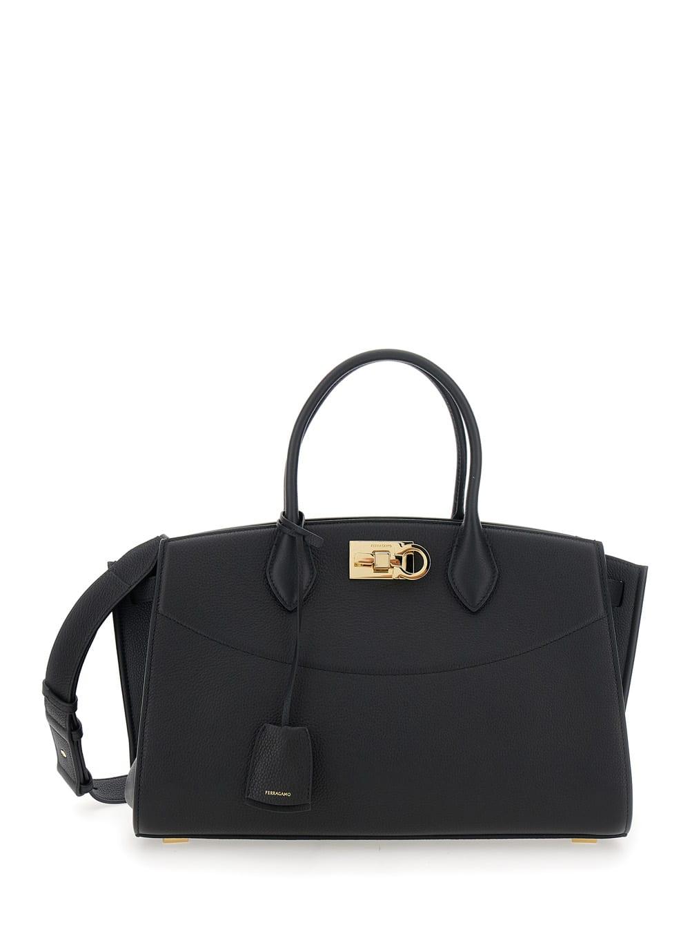 ferragamo black handbag with adjustable and removable shoulder strap and gancini turn-lock closure in grained leather woman