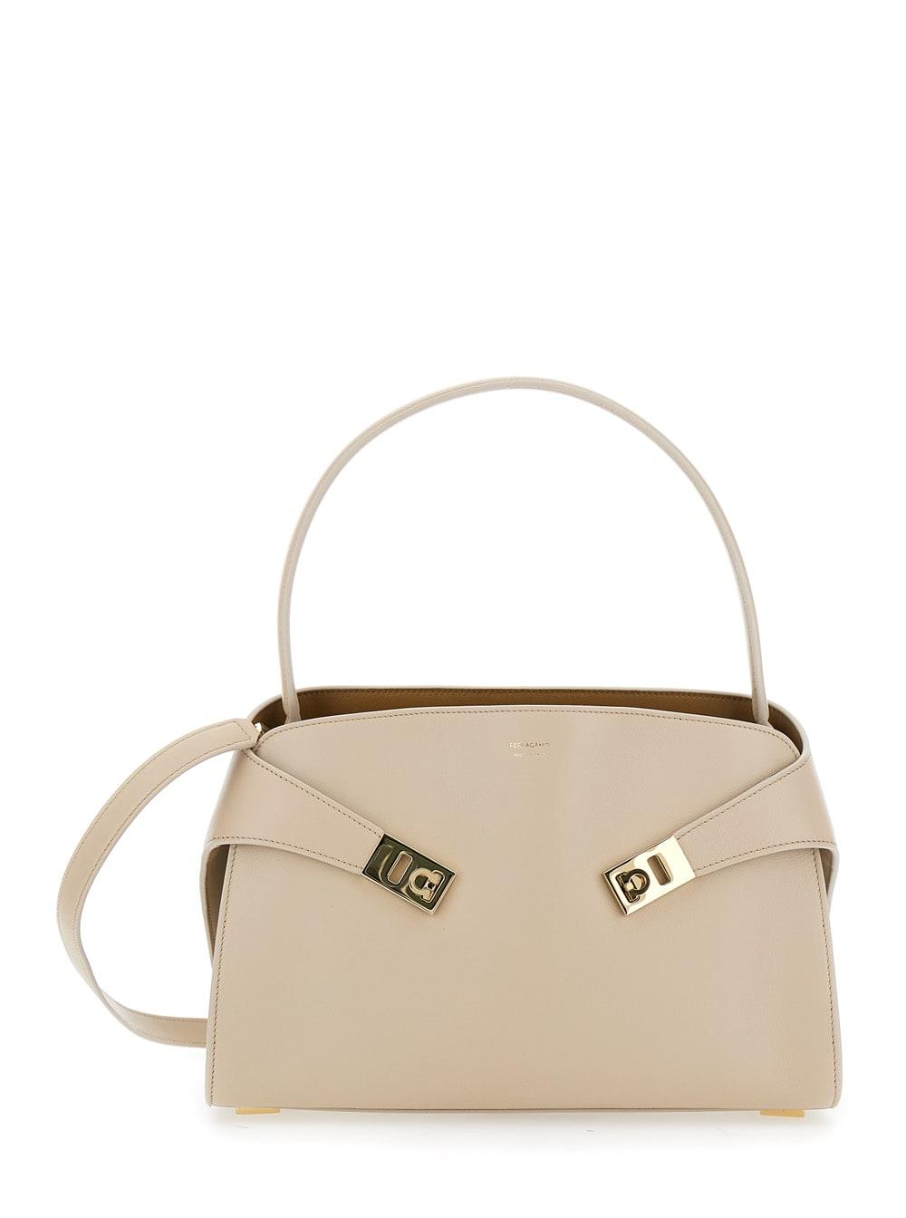 ferragamo hug beige shoulder bag with logo print on the front in leather woman
