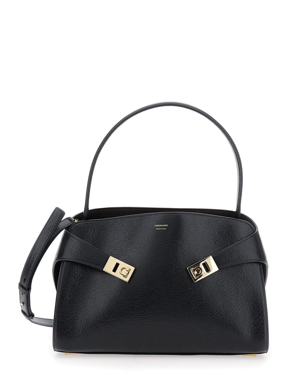 ferragamo hug black shoulder bag with logo print on the front in leather woman