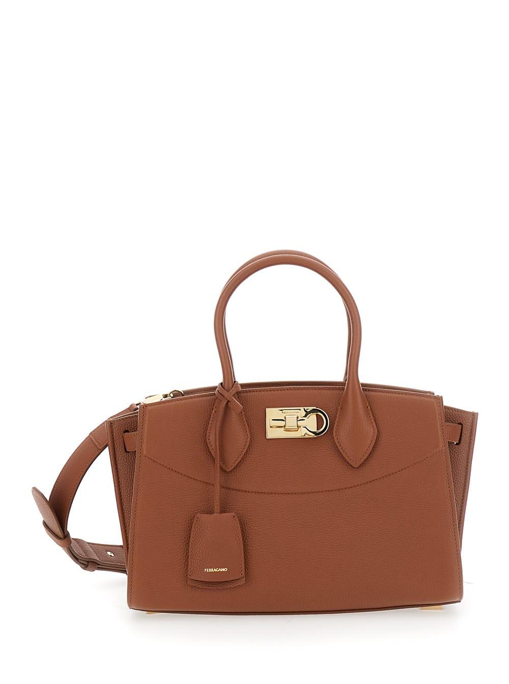 ferragamo soft brown handbag with adjustable and removable shoulder strap and removable logo tag on the front in leather woman