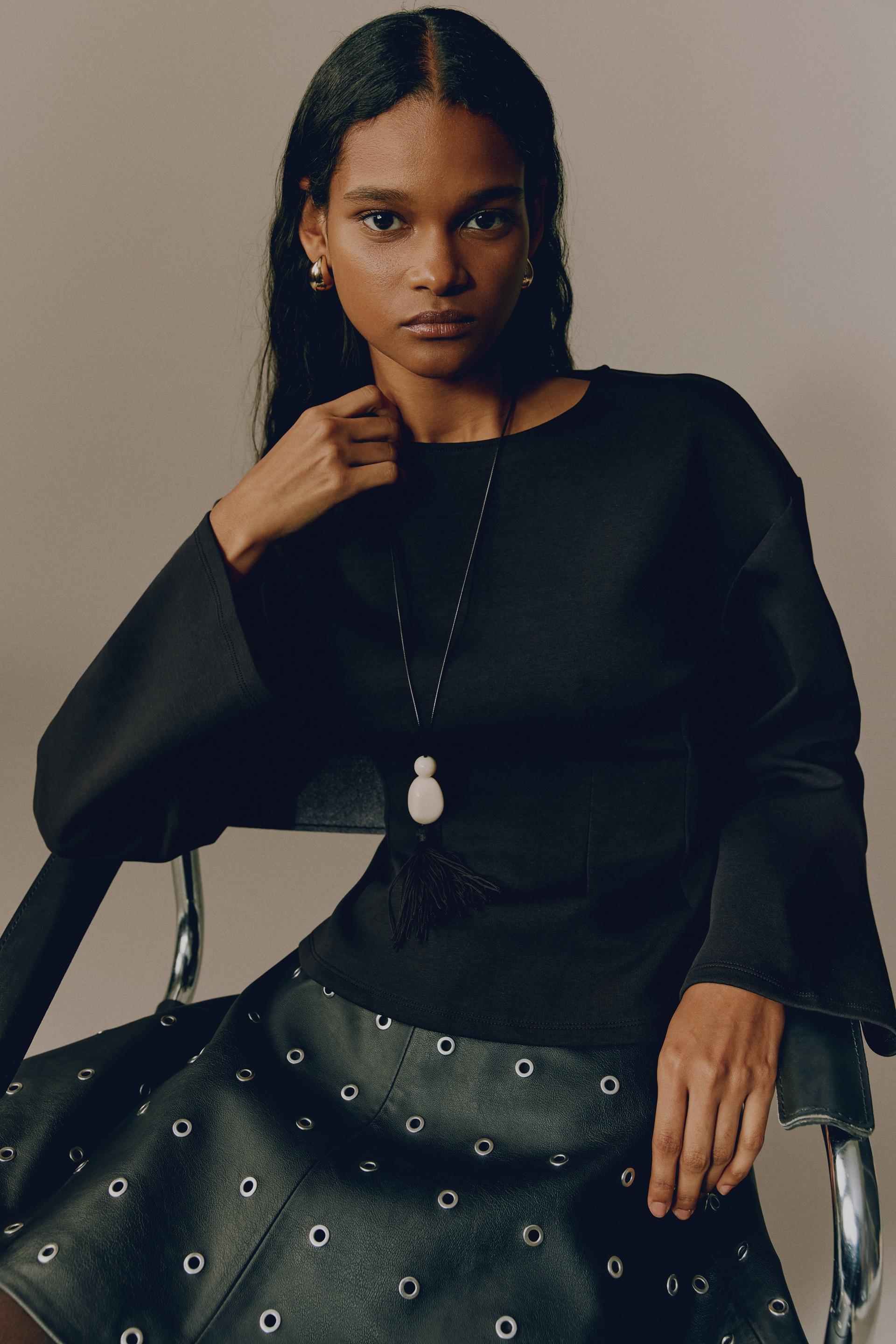 fitted-waist interlock top