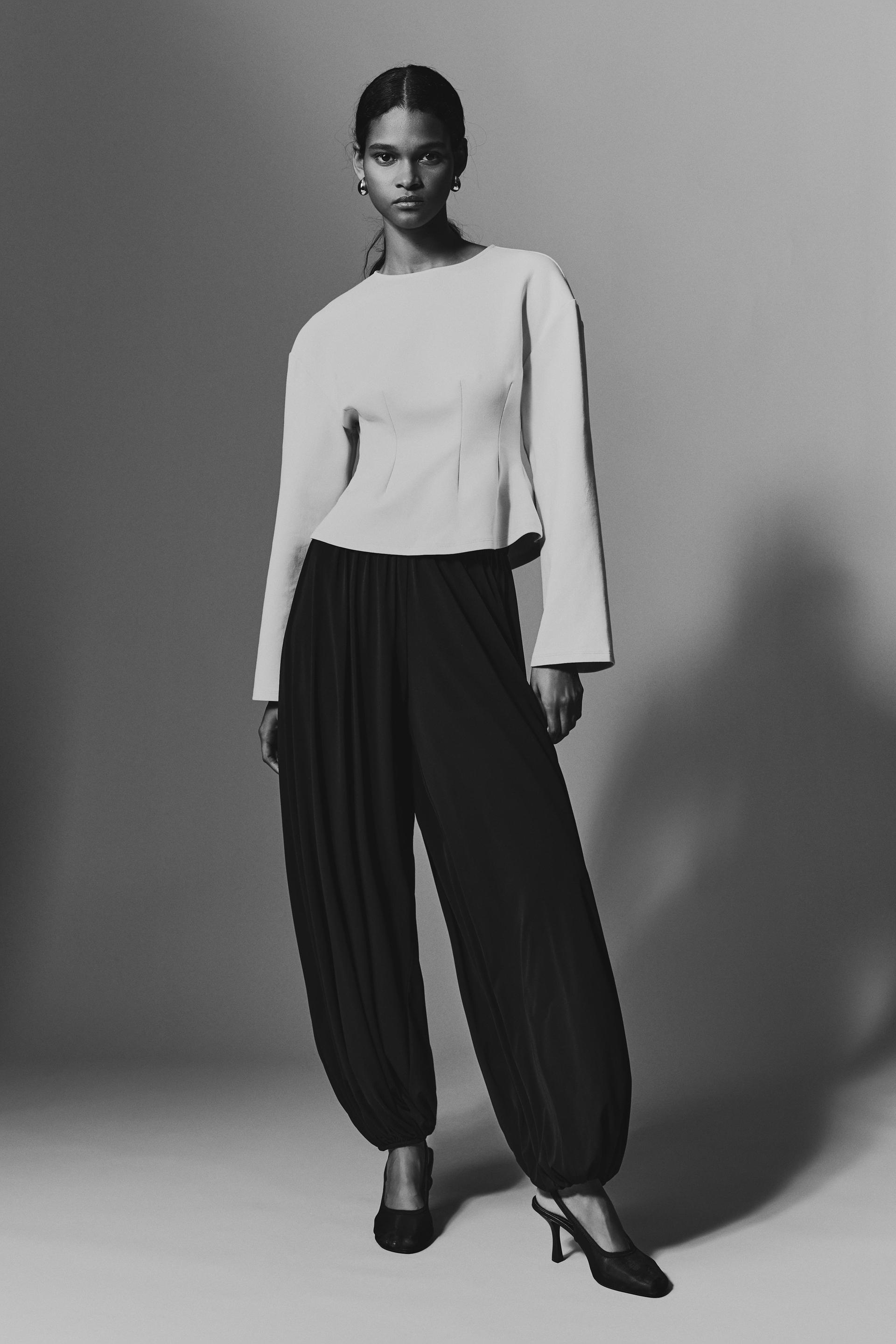 fitted-waist interlock top
