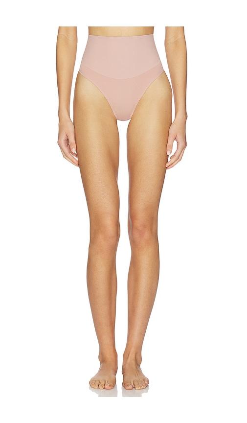 fleur du mal le stretch micro high waist thong in tan.