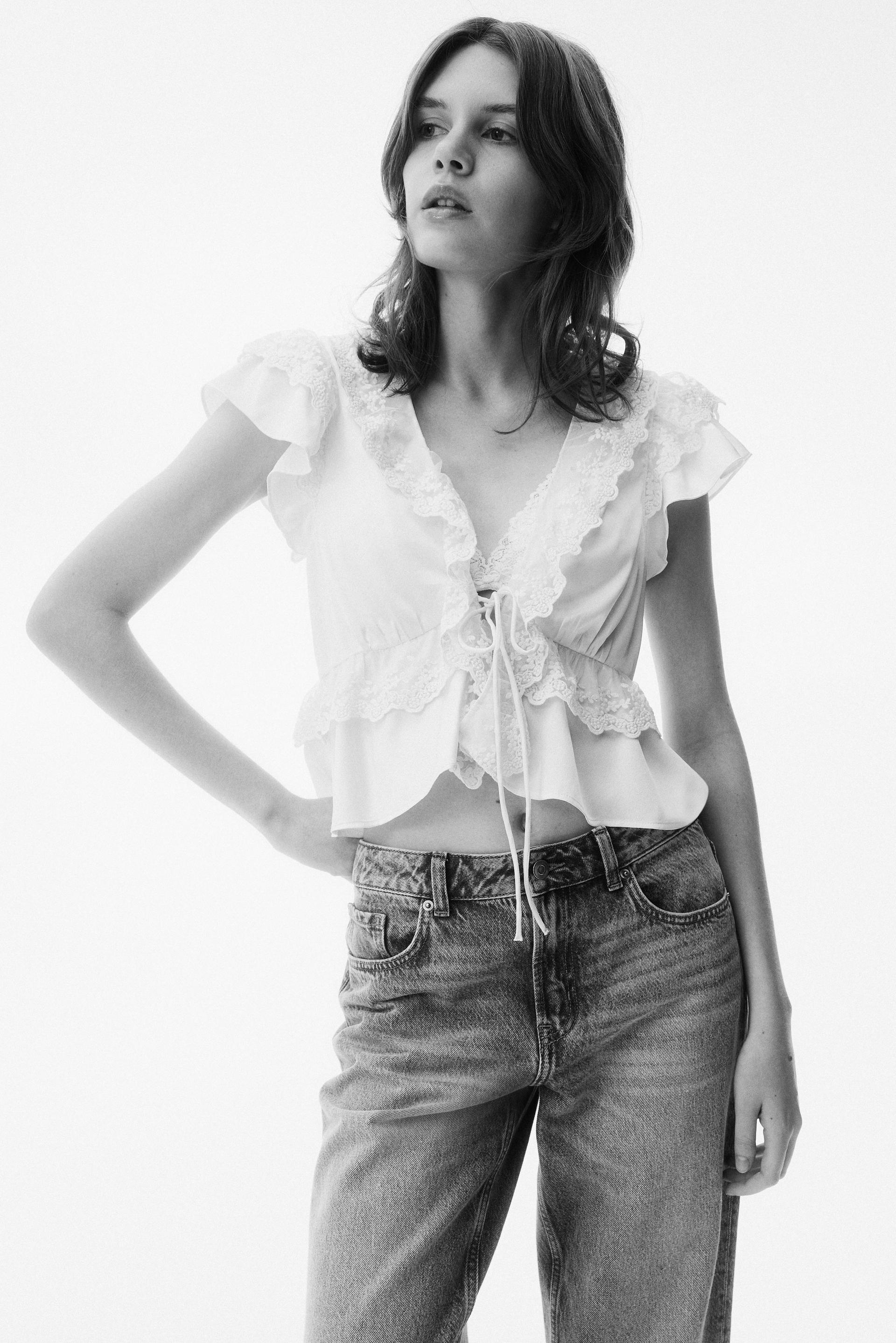 flounce-trimmed satin blouse