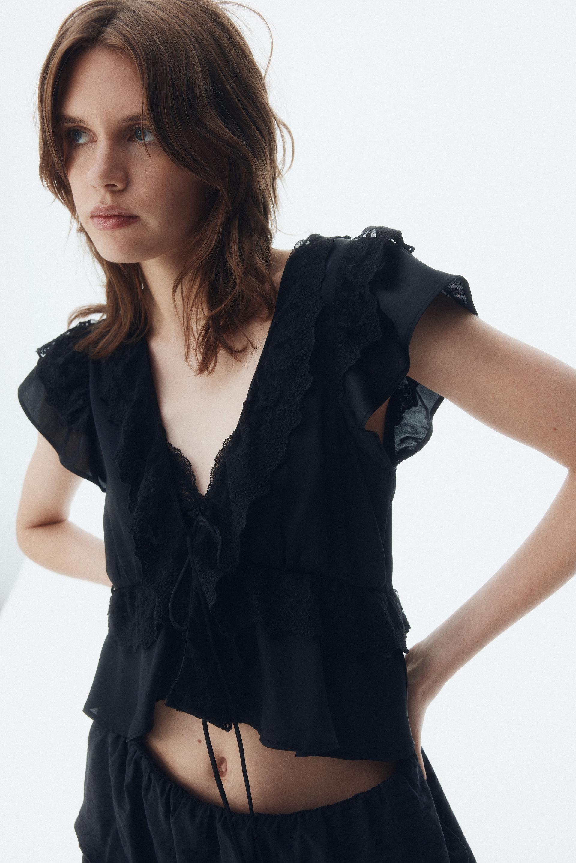flounce-trimmed satin blouse