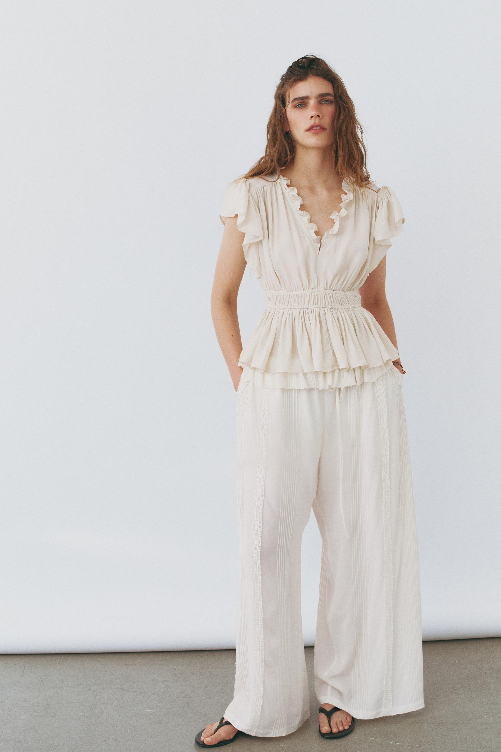 flutter-sleeved peplum blouse