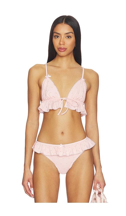 for love & lemons polka dot ruffle bikini top in peach.