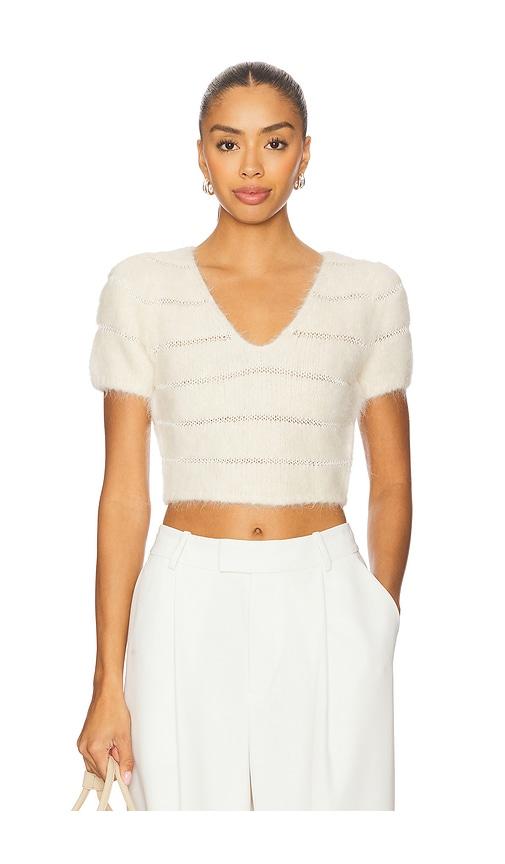 frame the cloud sweater in cream.