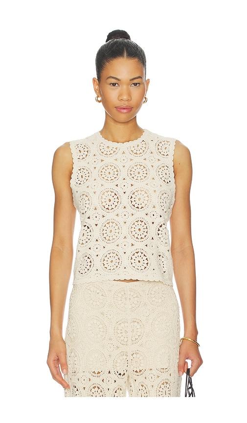 frame the crochet tank in cream.