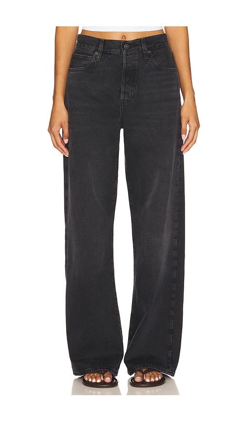 frame the loose jeans in black.