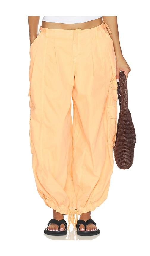 free people x fp movement charmer utility pant in orange.