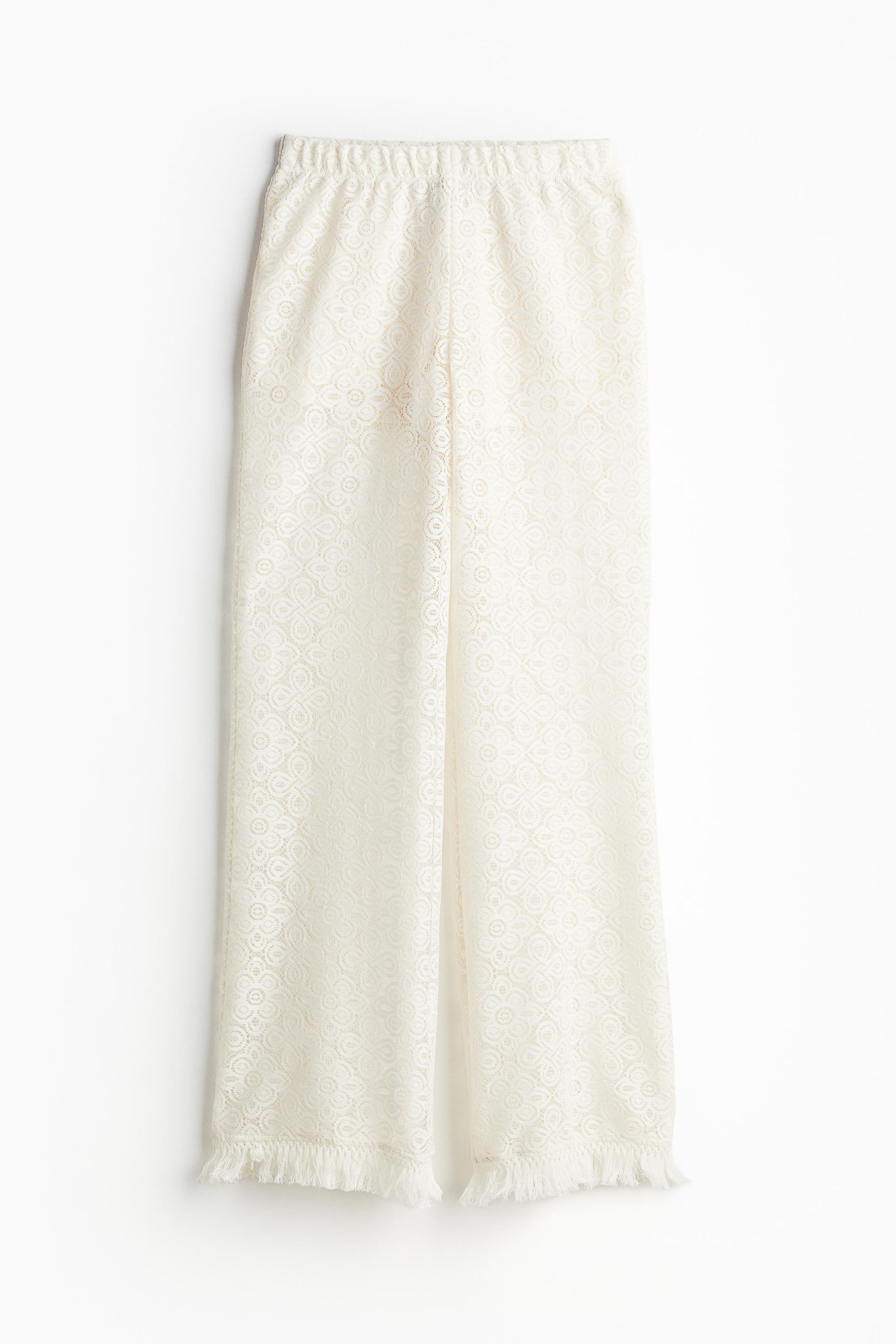 fringe-trimmed flared lace pants