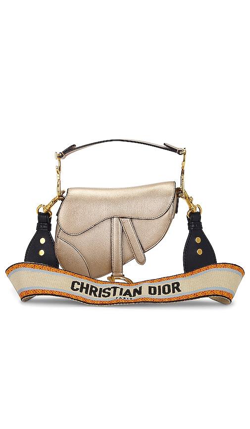 fwrd renew dior mini saddle bag in metallic gold.