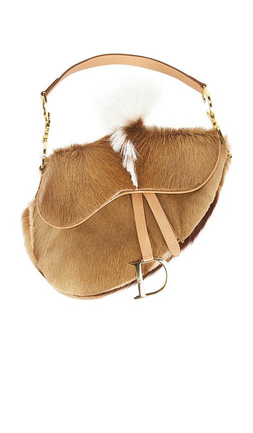 fwrd renew dior pony hair mohawk saddle bag in brown.