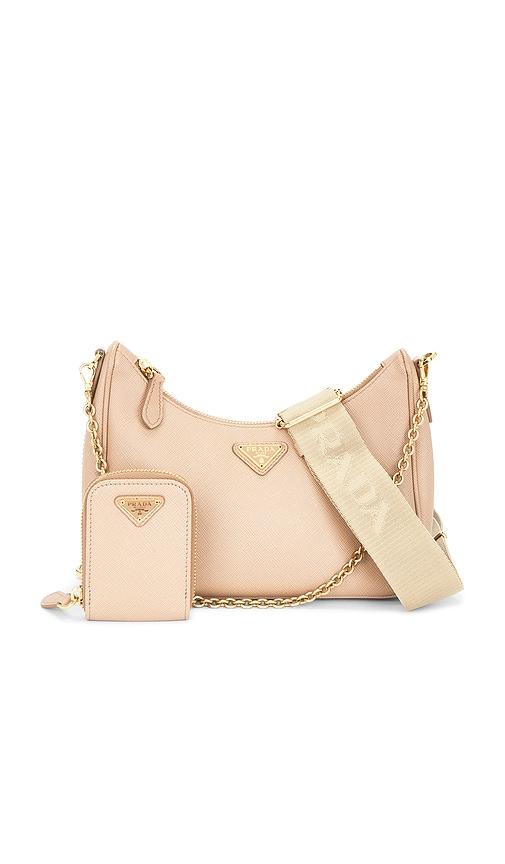fwrd renew prada re-edition 2005 saffiano shoulder bag in beige.