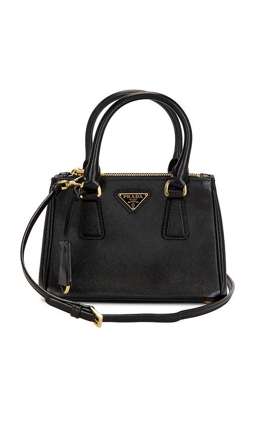 fwrd renew prada saffiano handbag in black.