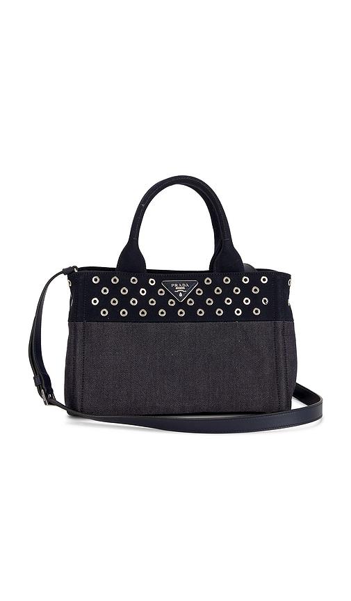 fwrd renew prada studded denim canapa tote bag in blue.