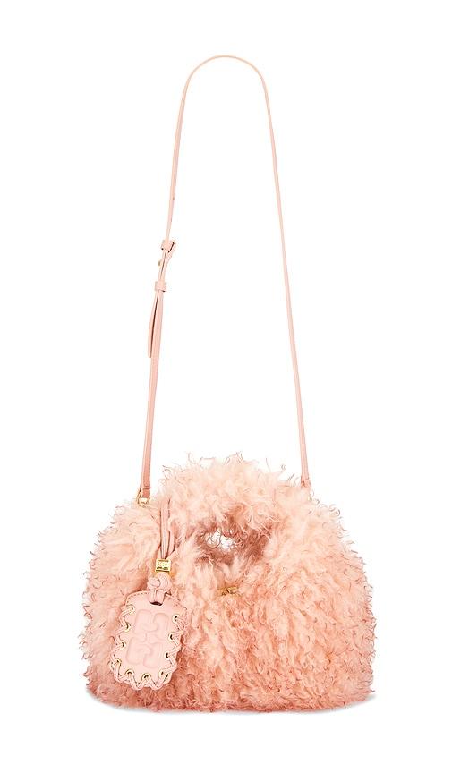 ganni mini fur hobo bag in pink.
