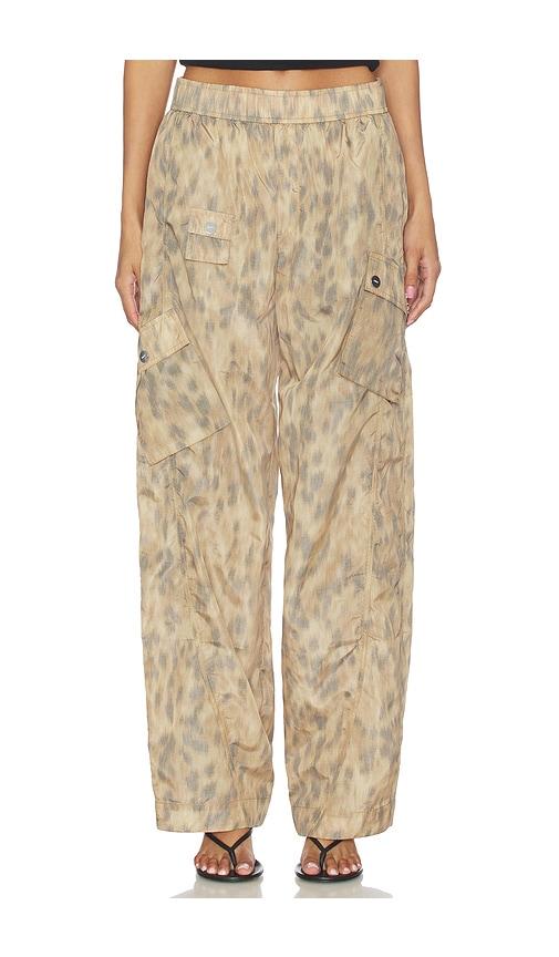 ganni printed flyweight nylon relaxed elastic pant in beige.
