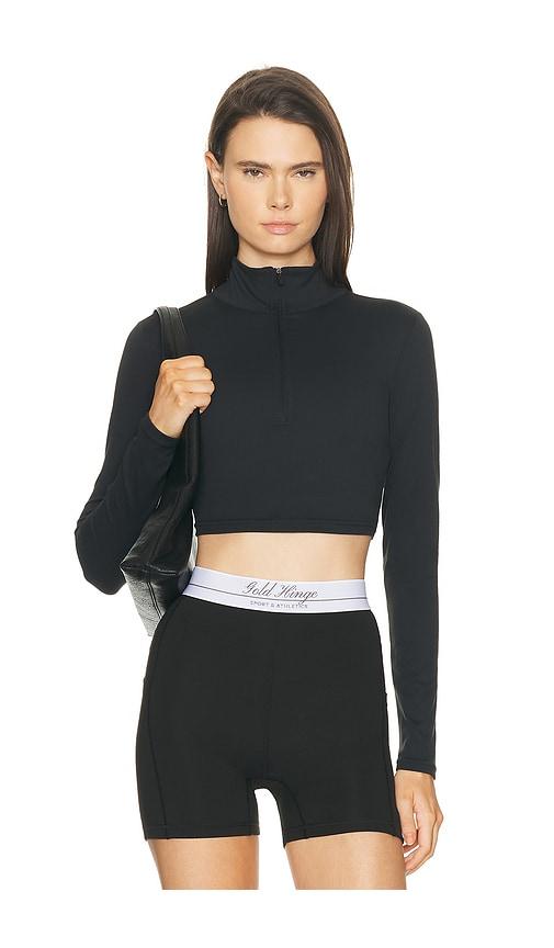 gold hinge athletic half zip crop top in black.