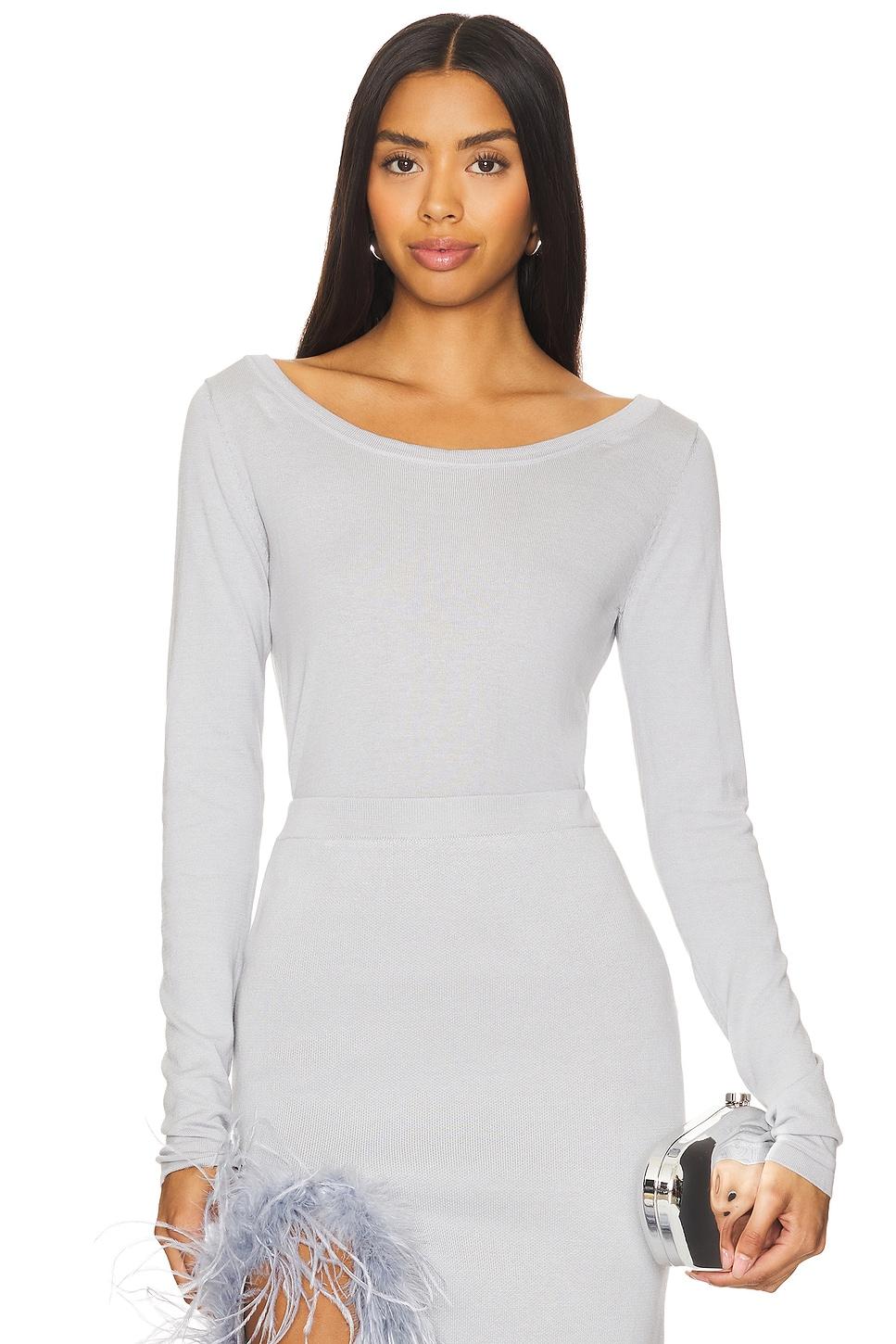 grey knit top with feathers