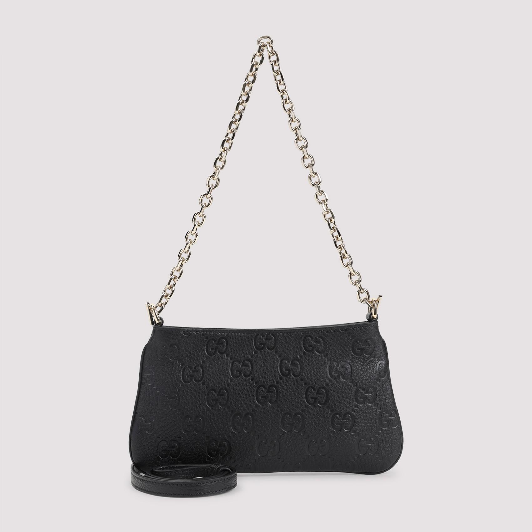 gucci gg emblem mini bag black grained leather smallleathergoods - women