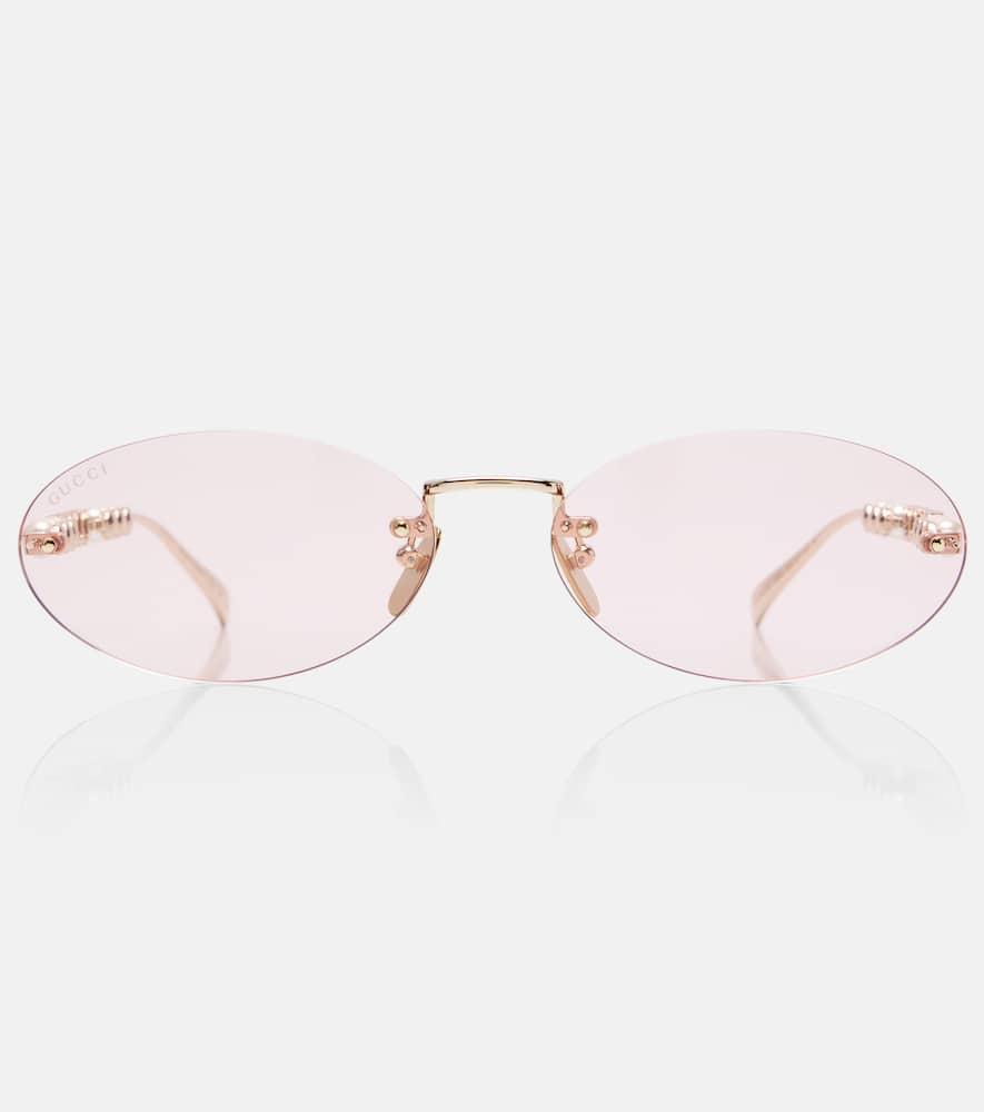 gucci logo embellished oval sunglasses