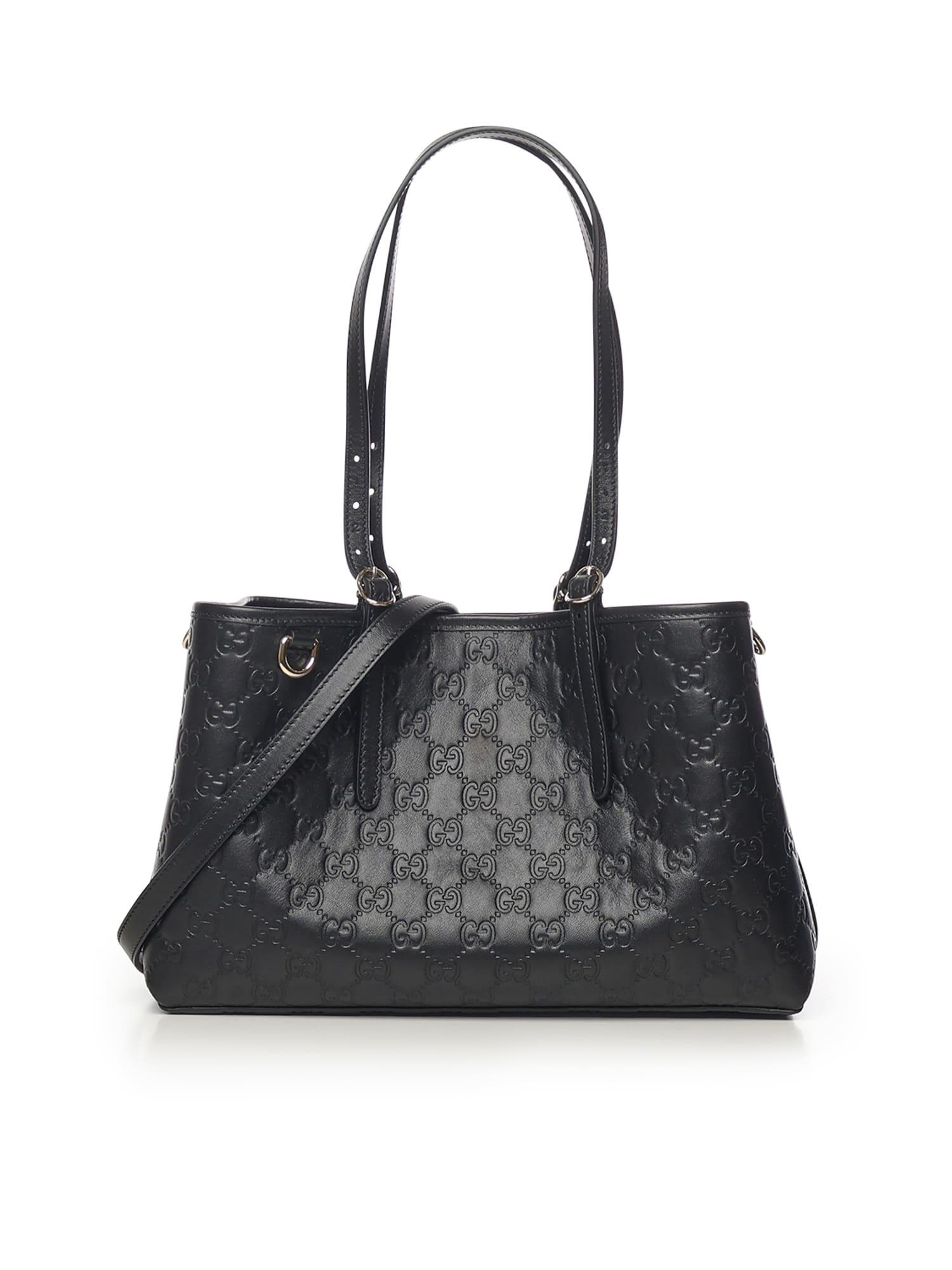 gucci medium gg emblem leather tote bag