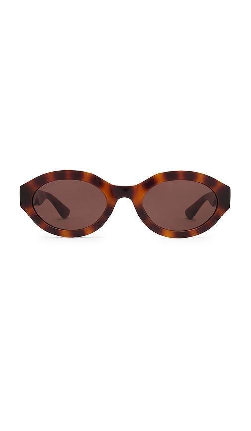 gucci oval sunglasses in brown.