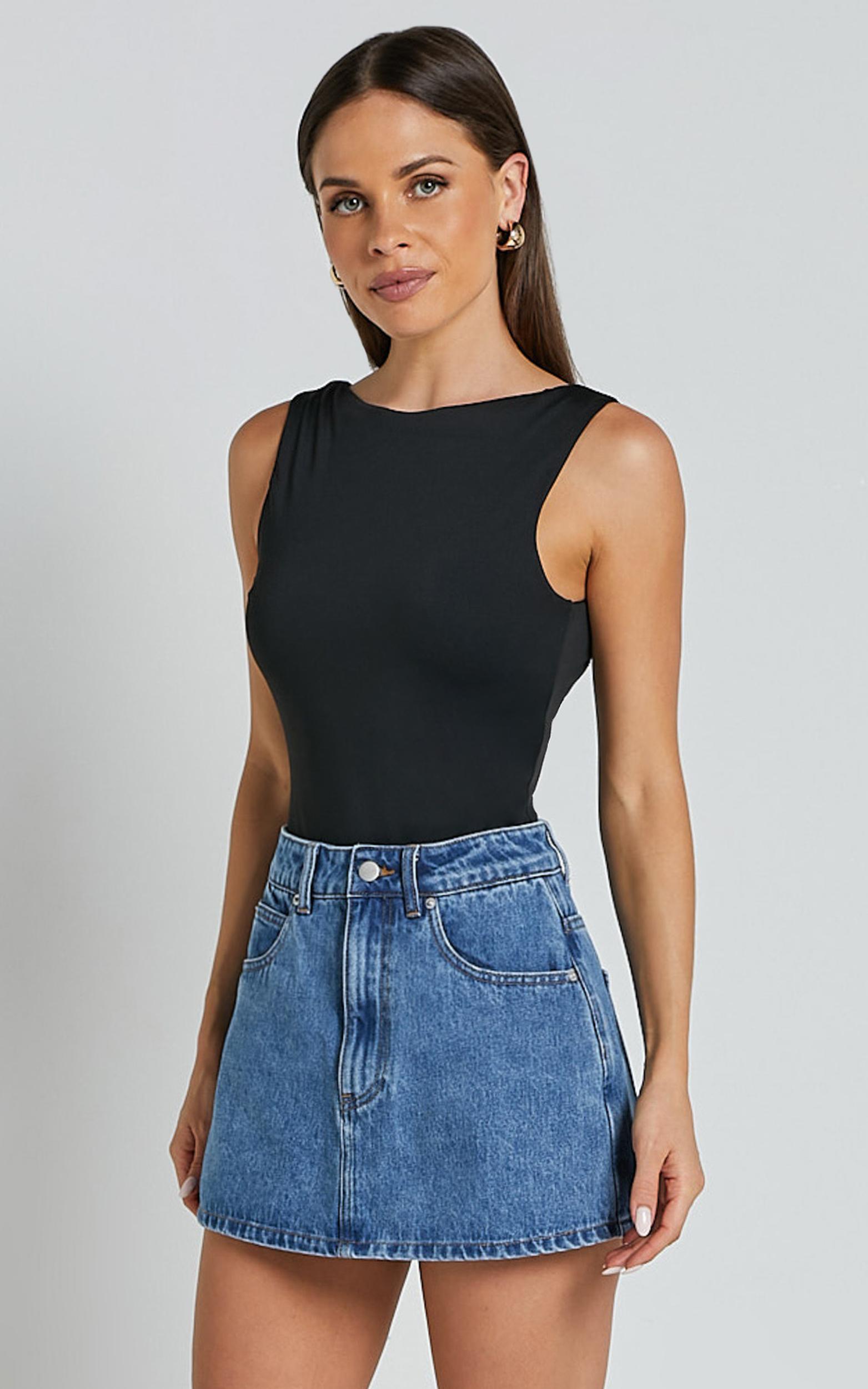 harriet skort - mid waisted recycled denim skort in mid blue wash