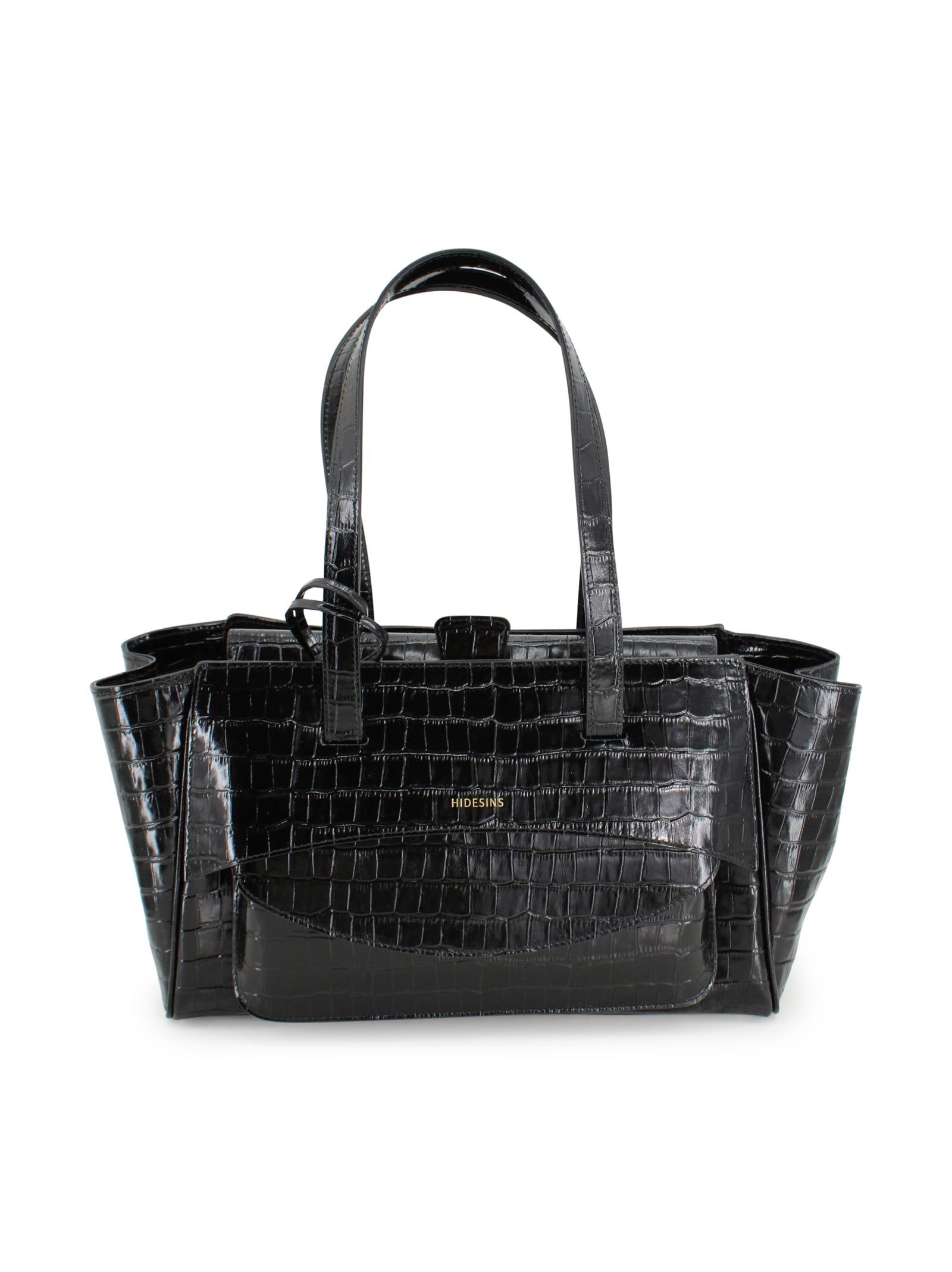hidesins shiny patent leather crocodile-effect bag.