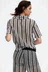 hole-patterned top with collar