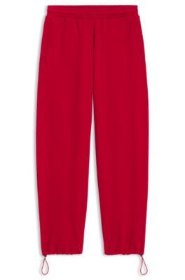 hugo peached-cotton tracksuit bottoms in a baggy fit - dark red women's pants
