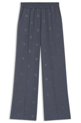 hugo relaxed-fit trousers with stacked logos - patterned women's pants