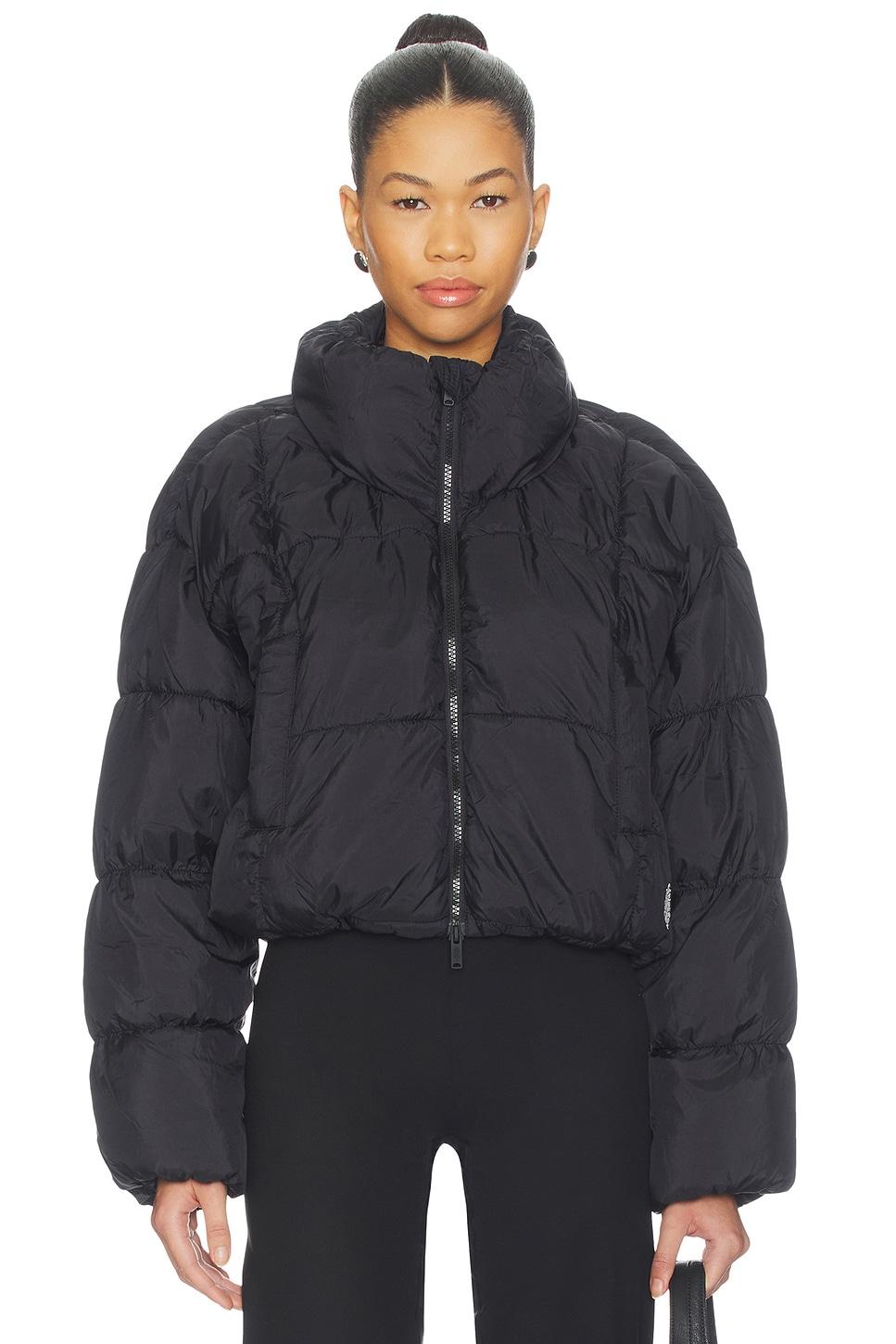 in a bubble puffer jacket