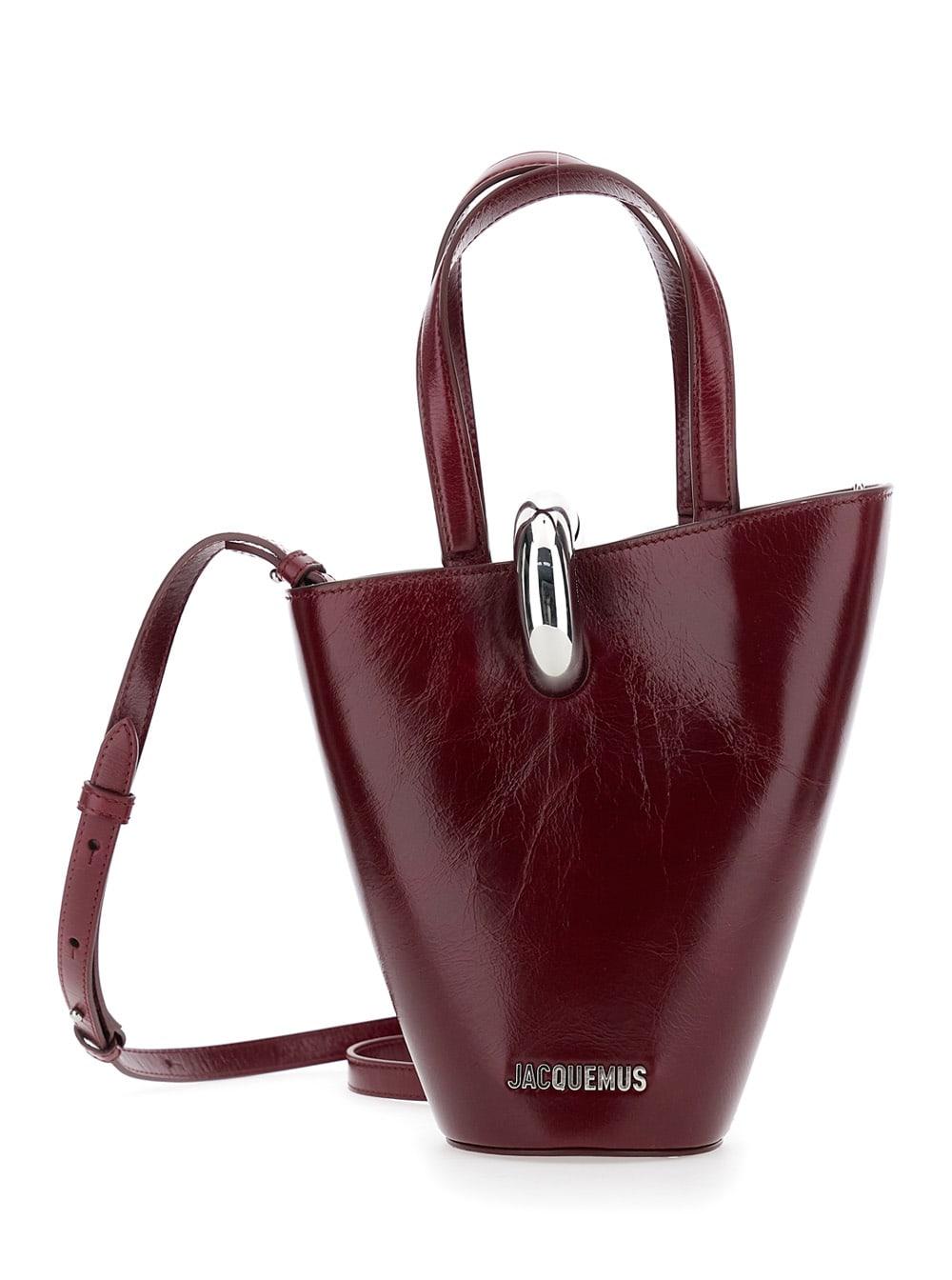 jacquemus le petit bambola bordeaux handbag with ring hardware detail and logo lettering in leather woman