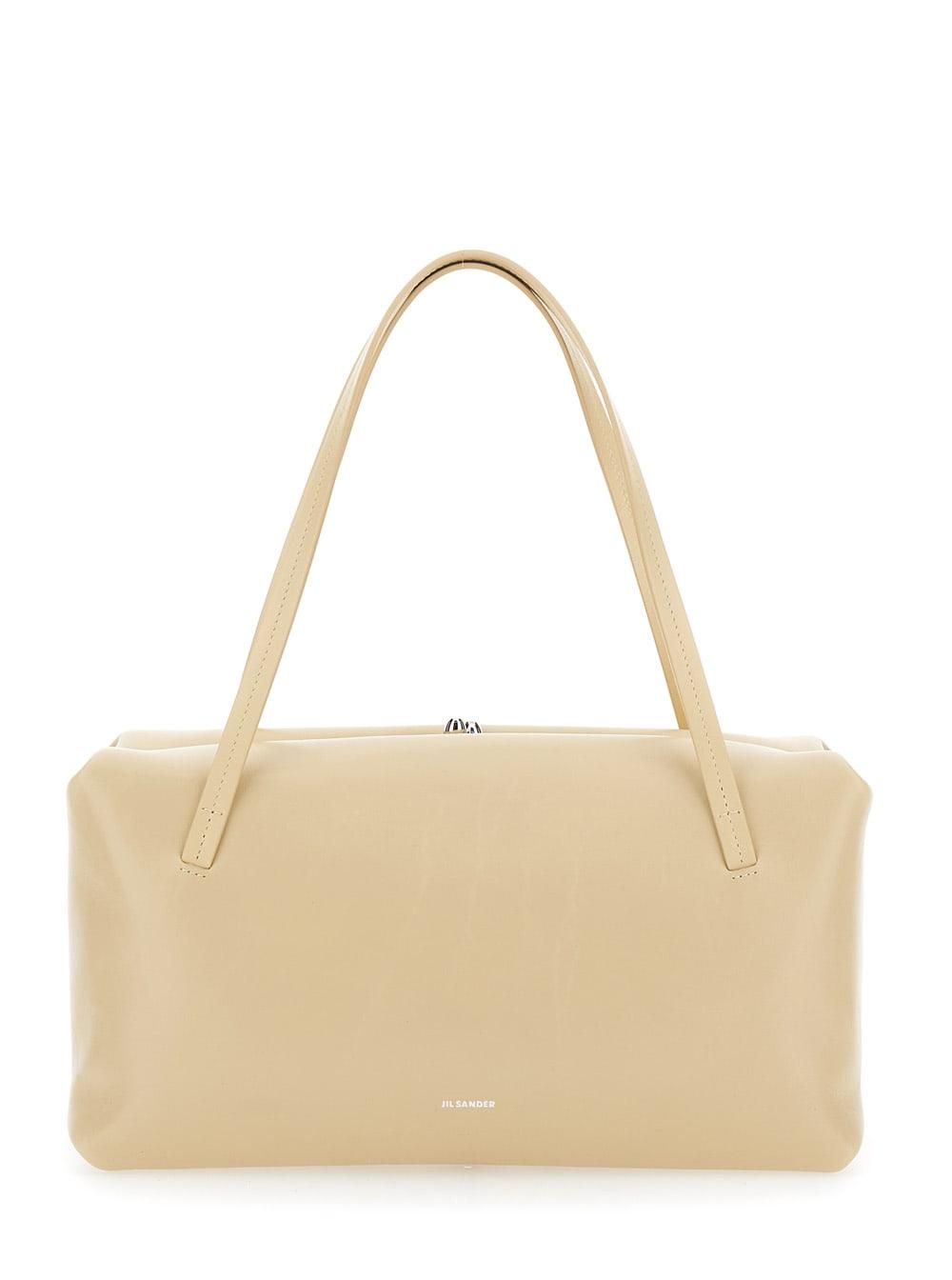 jil sander goji pillow beige shoulder bag with clasp closure and logo lettering on the front in leather woman