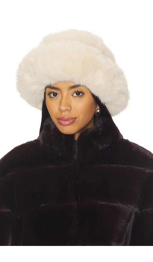 jocelyn oversized faux fur bucket hat in beige.