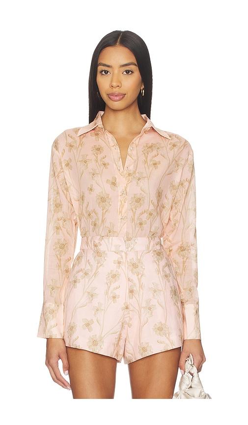 karina grimaldi coral print blouse in peach.