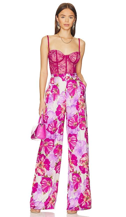 katie may tink jumpsuit in fuchsia.