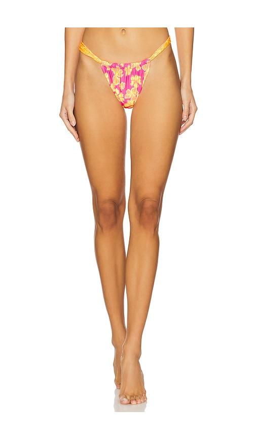 kulani kinis ruched thong bikini bottom in pink,orange.