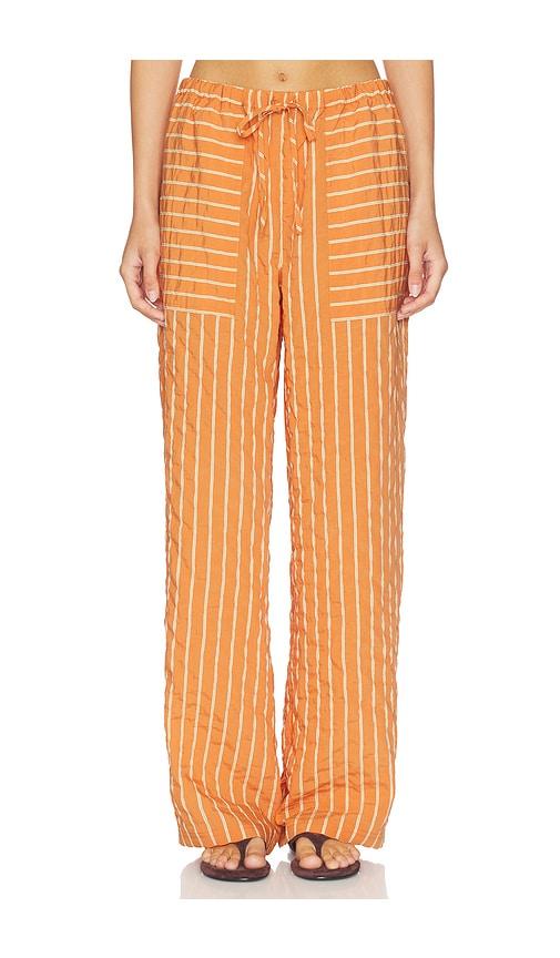 la ligne drawstring pull on pant in orange.