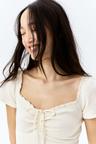 lace-trimmed dress with flared skirt