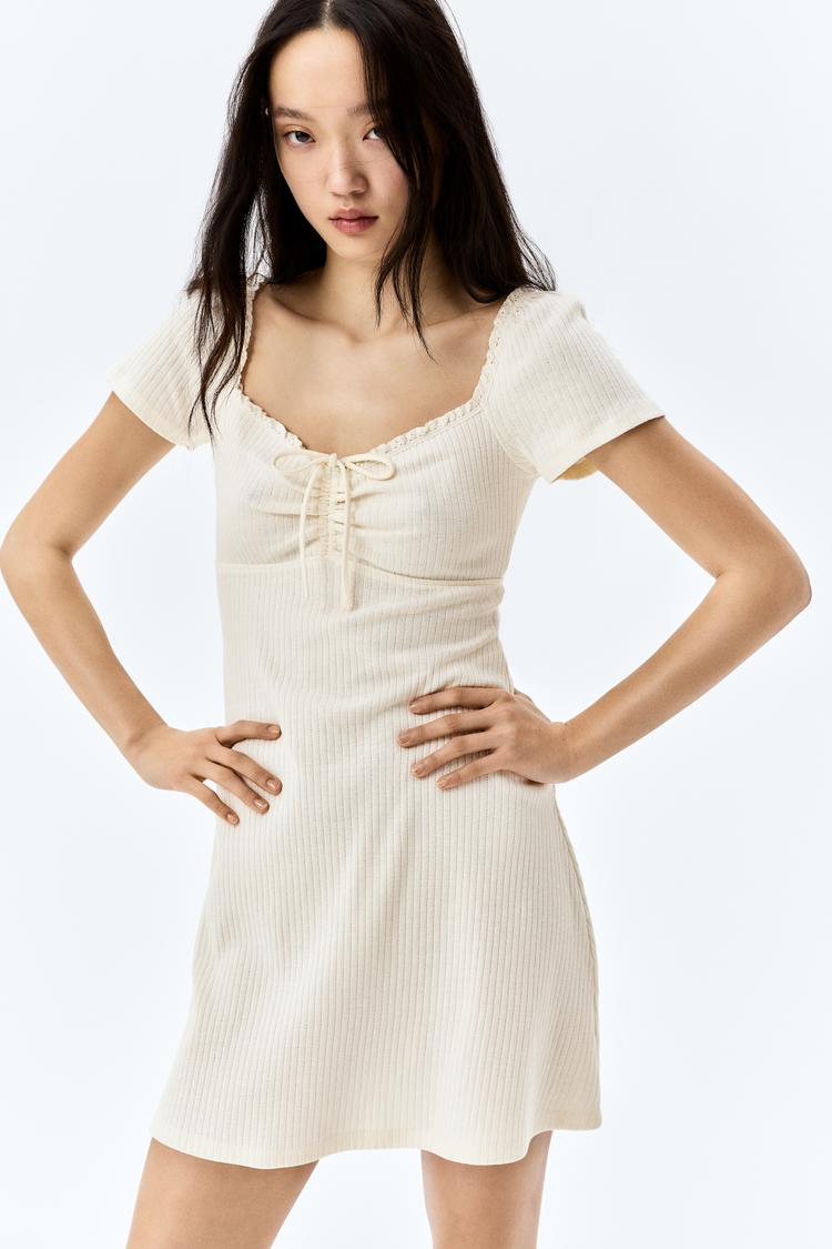 lace-trimmed dress with flared skirt